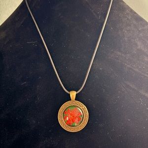 leather with small glass/brass floral pendant